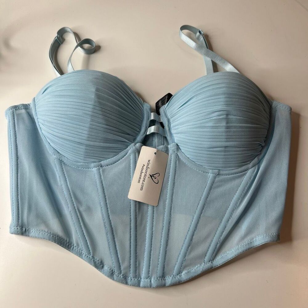 Windsor baby blue corset top features a sweetheart neckline with pleated satin f